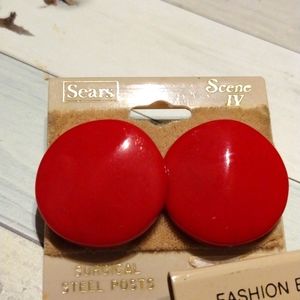 Red earrings about quarter sized with surgical steel posts.